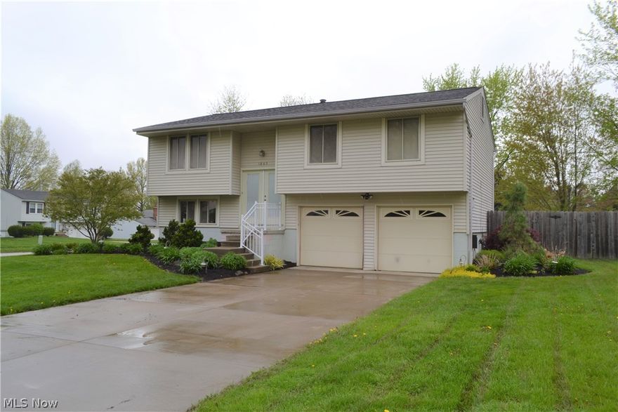 Spacious Bi-level features 3 Bedrooms, 1.5 Bath. Updated, Eat-in Kitchen with vaulted ceilings, solid surface counter tops, stainless steel appliances and laminate flooring. Vaulted Living Room with newer carpet. 3 bedrooms with laminate flooring (Bedroom #3 is currently being used as a walk-in closet). Updated Main bath with white vanity and newer tub surround. The lower level features a large rec room with newer carpet, laundry room and half bath. Light and bright neutral decor! 2 car attached garage. Updates include vinyl windows and siding, mechanicals, garage doors, driveway, landscaping and a brand new roof (2019)! Relaxing deck overlooks the private, fenced backyard. Great location close to shopping and restaurants! Quick access to Route 8 and the Ohio Turnpike. As per auditor, 480 of square foot living area is finished lower level.