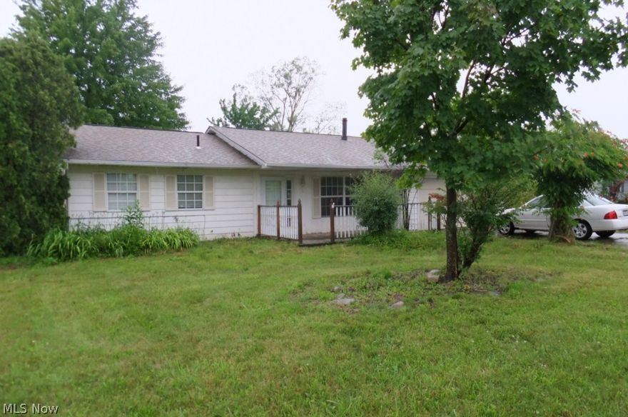 Great home for the price! Ranch style 3 bedroom home with 1.5 baths on over an acre of land! Blackberry bushes are Abundant across the entire back of property! 12X24 foot sunroom boasts extra-large hot tub that is staying! Outbuilding is huge for extra storage with a loft over each side! Re-sided in 2013-Aluminum siding was painted 8 yrs ago-Roof is 10 yrs old, Hot water tank was installed in 2013 and there was additional parking and widening of the driveway-Home also features a cement patio and a wood front porch 10X16! Newer ceramic tiled flooring in both bathrooms, kitchen and laundry area was added 7 yrs ago along with newer counter tops and some additional kitchen cabinets and ceiling fans and the vented skylight to kitchen! Also newer ceiling fan in family room! Attached two car garage with extra storage over shelving!