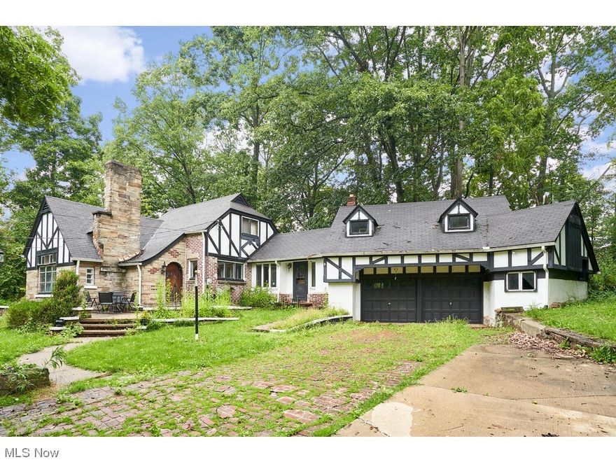 Franklin Township unique Tudor.  3 bedrooms, 2 baths, first floor bedroom, hardwood floors, fireplace in living room and breezeway, dining room off kitchen.  Workshop over 2 car attached garage.  Located on 2 parcels.  New hot water tank , expansion tank for well and water softener.