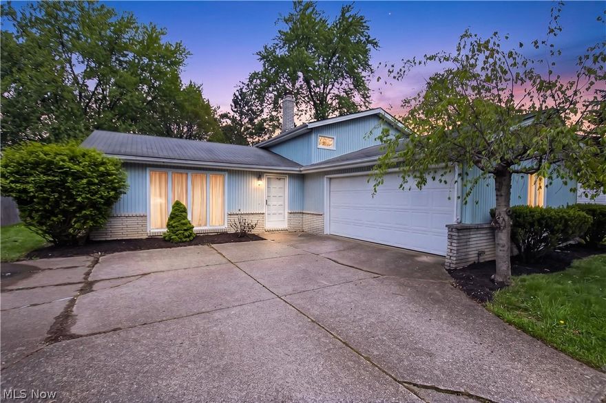 What a great find in Brunswick! Come be a part of the Forest Hills neighborhood at a great price-point, known for its welcoming feel and friendly neighbors. This freshly-landscaped split level is ready for its new owner; and with just a few projects this home is primed to become both a terrific investment and a perfect place to live. The bright, cheerful white walls throughout create a light and inviting atmosphere, offering the perfect blank canvas to truly make the space your own. New wood-look vinyl flooring runs throughout the spacious living room and dining room. The kitchen offers abundant counter space, ample cabinet storage, along with a pantry. It's also large enough to fit a table! A sliding door provides access to a covered porch and private back yard that's ideal for hosting your summer get-togethers. Upstairs you'll find three newly-painted bedrooms with hardwood floors, and a bathroom featuring a new toilet as well as a stand-up shower! The bathroom even attaches to the rear bedroom for ultimate convenience. The lower level has wood-paneled walls, a wood-burning fireplace, and a half bath, which will be perfect for cozy family movie nights. But that's not all - a laundry room / utility room provides space for a work area or storage, and attaches to the spacious 2.5 car garage. The garage can easily house two vehicles as well as your yard equipment and tools. Whether you're looking to settle in or add your personal touch over time, this home offers incredible potential in a neighborhood you'll love being part of. Opportunities like this don't come around often so call your favorite Realtor and get in TODAY!