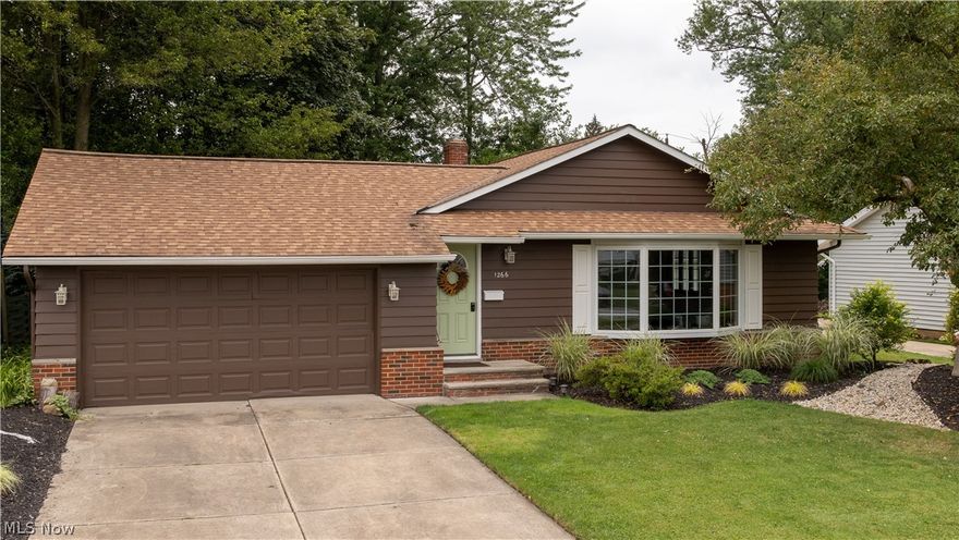 Stunning one owner ranch is pristine and recently updated throughout. Whether you are seeking your starter home or "right" sizing, this may be your perfect home. Conveniently located in Mayfield Heights, close to schools, shopping, highway, recreation, etc. Well cared for home is in excellent condition, interior freshly painted in 2021 new hardwood floor in the kitchen and all other professionally refinished (2020). Updates galore! Inviting charming living room has open bright bay window,  refinished wood flooring and the signature fireplace with hand selected Ohio River rocks which opens to the dining room. Sparking updated kitchen features newer appliances including brand new stove and microwave (2021) with new cabinets, granite countertops, sink and fixture. Both bathrooms are completely renovated with the master bath (back to the studs) and all new. All light fixtures have been replaced and most windows were recently replaced. This house has wonderful landscaping. and a private bac