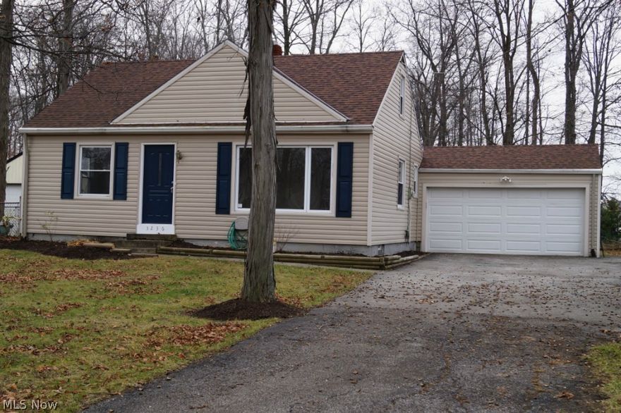 Charming Cape Cod on half acre. Clean and updated with fresh paint, new carpeting and laminate flooring. Newer kitchen, tilt-in windows, roof, siding and furnace. brand new hot water tank. Two car garage. 2 bedrooms on main floor, 2 bedrooms on second floor, or use one as an office. Spacious fenced in back yard is great for entertaining and extends beyond the fence to the pine trees. Close to shopping and freeways. A great place to call home.