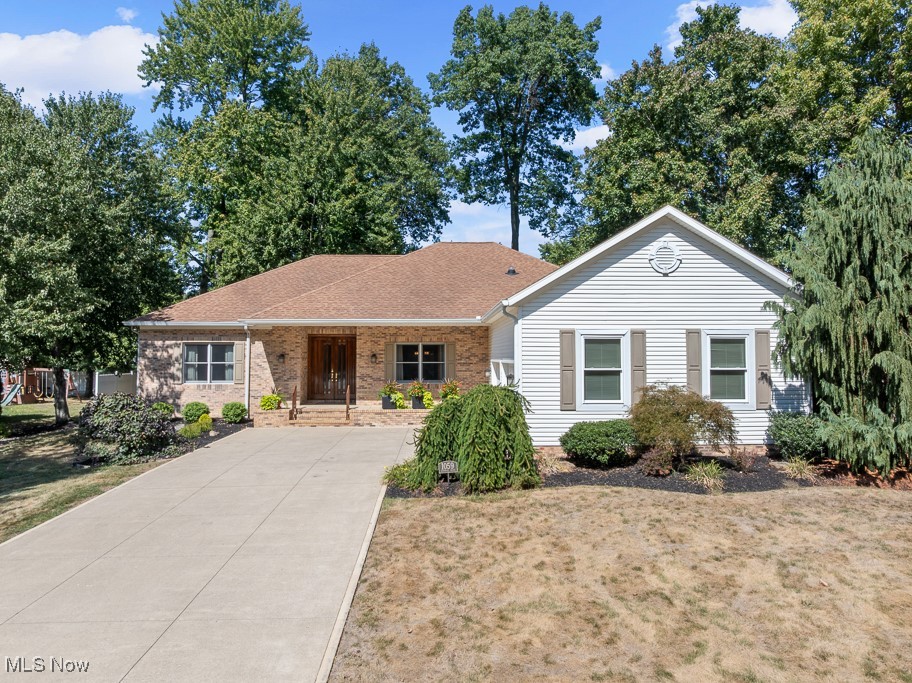 This impeccably maintained, top-of-the-line ranch offers a spacious and inviting layout with three bedrooms and two oversized full baths. The split-sided design ensures privacy, while the luxurious master suite features double walk-in closets, an updated bath with double sinks, a separate shower, and a soaking tub. The modern kitchen is a chef’s dream, complete with stainless steel appliances, abundant cabinetry, a large island, and an open dinette area. Just off the kitchen, a stunning screened-in porch with cathedral ceilings provides serene views and a perfect space for entertaining. The great room boasts 10-foot ceilings, a gas fireplace, and high-end flooring, flowing seamlessly into the formal dining room—ideal for hosting gatherings or holiday feasts. A second large bedroom and updated bath are located on the west side of the home, along with generous storage throughout. Additional features include a full basement with potential for finishing, a whole-house generator, oversized garage, concrete driveway, updated furnace, and first-floor laundry. With only two owners, this home has been lovingly cared for and is truly move-in ready. Schedule your private showing today!