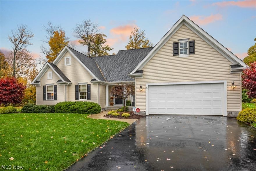 Exquisite custom built home by Ken Hunter.  Beautiful open floor plan.  From the second you enter you will notice the hardwood floors, vaulted ceiling and attention to detail.  Kitchen offers porcelain tile countertops and stainless appliances.  Sunroom overlooks private backyard that backs up to the Avalon Lakes Golf Course.  The family room finishes are gorgeous with fireplace & bookshelves.  Master bedroom also has vaulted ceilings & master bath features bathtub & ceramic tile shower.  The lower level showcases an additional entertaining area with bar, 2 bedrooms and full bath.  Absolutely stunning!