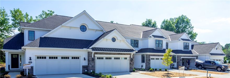 Beautiful 2-story townhome with full basement and upscale finishes under construction in a prime Fairlawn location, minutes from I-77 and amenities in Montrose/Akron/Fairlawn! White board and batten siding, black trimmed Pella windows, and metal roof accents provide striking curb appeal. The covered entry and dedicated foyer provide ample space to welcome guests. A dramatic 2-story great room with luxury vinyl plank flooring boasts a gas fireplace and gorgeous window wall that lets in loads of natural light and opens to the fully equipped kitchen. Upgraded white cabinetry with soft-close doors and drawers, granite counters, tile backsplash, and stainless appliances make for a beautiful presentation. A convenient and spacious powder room and laundry room complete the first floor. Upstairs, you’ll find two additional bedrooms and full bath, along with an enormous Owner’s Suite that features vaulted ceilings and an ensuite bath with dual sinks, two walk-in closets, and tile walk-in shower. Full basement is roughed-in for future full bath. Owner’s can take advantage of high-speed Fairlawn Gig internet and incredible property tax savings with the 85%, 15 year tax abatement! Estimated property taxes around $87 / month* with the tax abatement savings for 15 years! Photos are for illustrative purposes only, as home is currently in process for a 2023 move-in. *Property tax rates subject to change.