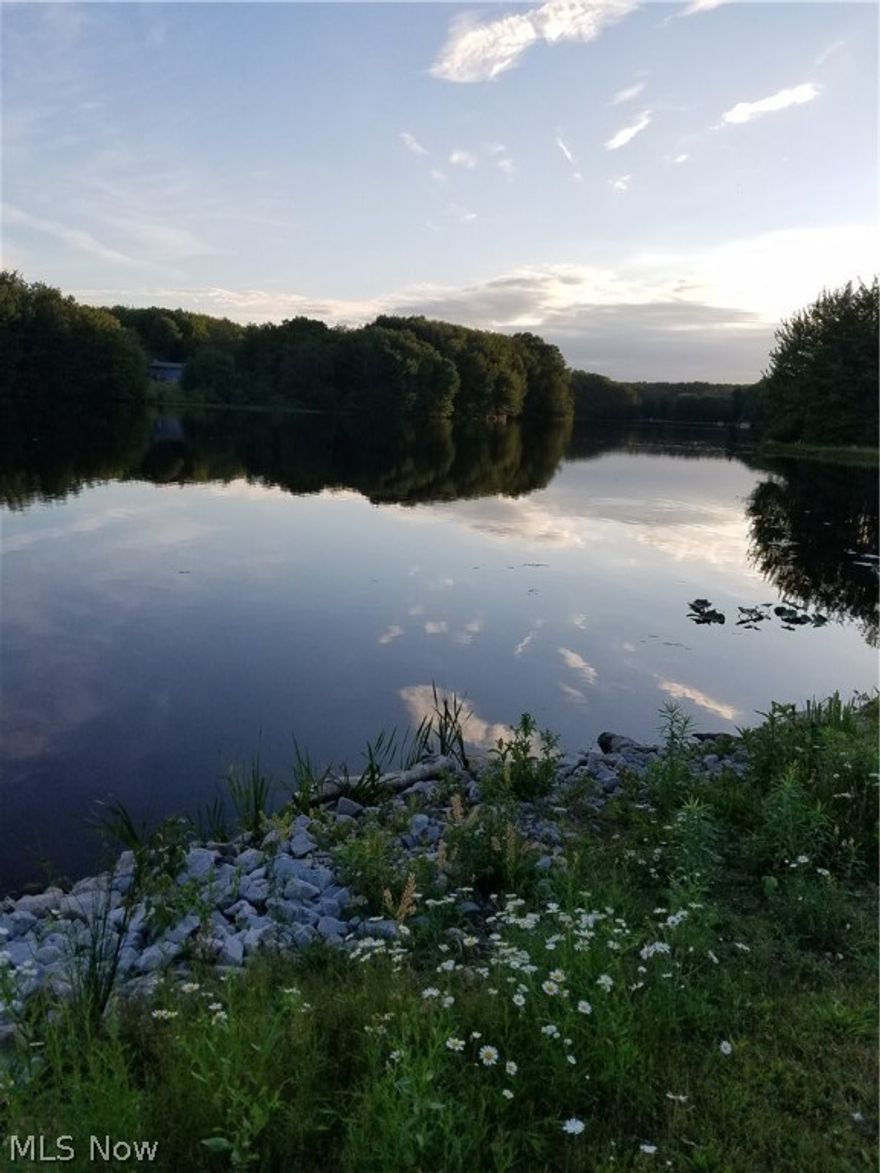 Beautiful buildable 3.2 acre lot on 70+ acre private Montmere Lake.  Fish/ice fish, canoe, kayak or bring your boat (electric motors).  Small shed on property for storage and unpaved drive. Private, wooded lot.  A must see to appreciate.