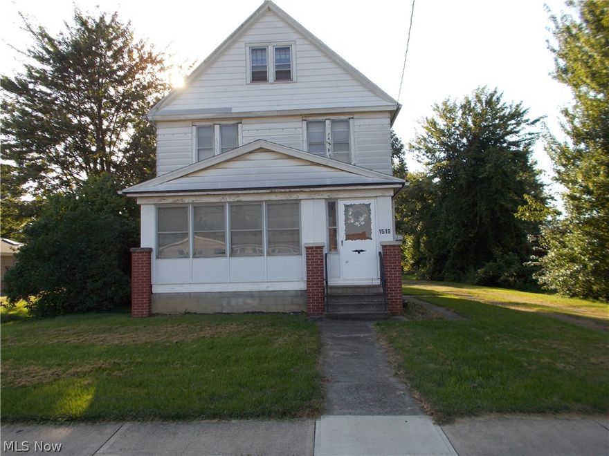 Handyman special; Great location with 3 car garage's. This home has so much potential; original Hard wood floors an wood trim through out the house.  The kitchen has the original wood cabnits.  The garage and basement both have a work shop.