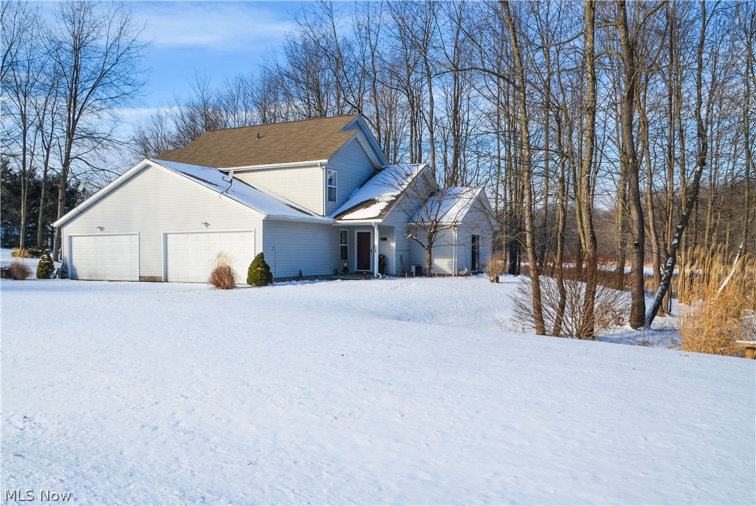 Nicely maintained Twinplex in Springfield's Rolling Meadows Estates. The home sits on 4.59 acres overlooking a beautiful marsh on a partially wooded lot. Each unit has three bedrooms, two full baths and features vaulted ceilings and attached two car garages. There is another two and one-half car 24' x 32' oversized-garage that is completely insulated and heated with electric and satellite hook-up! Both units include all appliances.