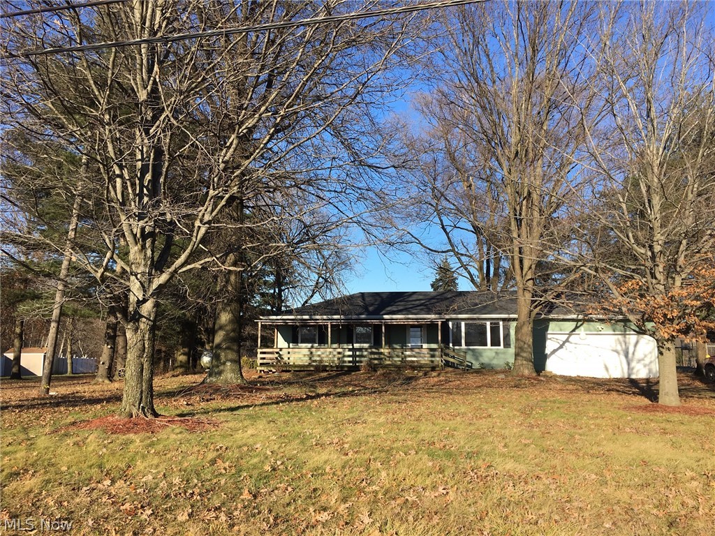 Perfect family ranch home in Marshallville! This home offers 3 bedrooms, one bath and a bonus bedroom on the lower level, situated on a wonderful .91 acre lot! Tucked in from Fulton Road, this property offers all the privacy and space you could need. Enjoy the outdoors from the large front porch and the multi-level back deck. The surrounding land makes it feel like you have much more than 1 acre. Inside you will find a bright living room with a spot for a wood burner. Opening up to the dining area, with sliders out to the back deck. The kitchen has nice laminate counter tops and oak cabinets. The bedrooms all have good sized closets and ceiling fans. The bathroom has ceramic tile, a nice vanity and linen closet. Downstairs, there is a large open basement with a bonus bedroom. The roof is brand new this year. Call today to take a look, before it's gone!