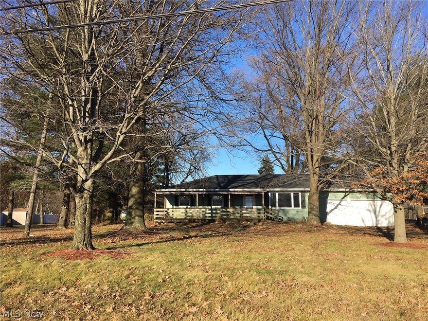 Perfect family ranch home in Marshallville!  This home offers 3 bedrooms, one bath and a bonus bedroom on the lower level, situated on a wonderful .91 acre lot!  Tucked in from Fulton Road, this property offers all the privacy and space you could need.  Enjoy the outdoors from the large front porch and the multi-level back deck.  The surrounding land makes it feel like you have much more than 1 acre.  Inside you will find a bright living room with a spot for a wood burner.  Opening up to the dining area, with sliders out to the back deck.  The kitchen has nice laminate counter tops and oak cabinets.  The bedrooms all have good sized closets and ceiling fans.  The bathroom has ceramic tile, a nice vanity and linen closet.  Downstairs, there is a large open basement with a bonus bedroom.  The roof is brand new this year.   Call today to take a look, before it's gone!