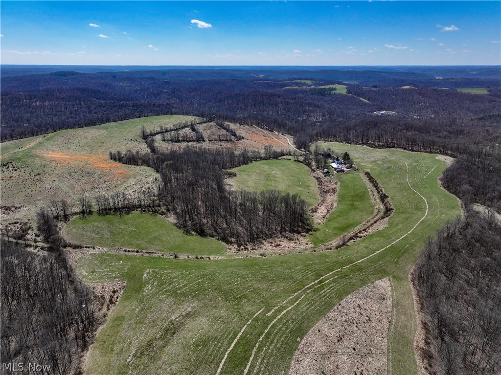 AUCTION!!! A rare opportunity presents itself in northern Coshocton County as a generational farm hits the market for the first time in nearly a century. This sprawling property, spanning 444 acres offered in 4 parcels or as a whole, boasts a picturesque landscape with a perfect blend of open fields and wooded areas. Abundance of vacant acreage in an area that doesn’t see much on the open market. This gem is located just below Clark in Northern Coshocton County. Property is mostly open but includes 110+ acres of woods and 3 homes. Winding trails and paths throughout the property. I navigated the whole property with a pickup truck with no issue. Just a stone’s throw from Holmes County. You’ll wear out a pair of Michelins before you find a property with better views locally. While the property includes three older homes and several outbuildings, they are in poor condition and sold "AS-IS." However, all seller-owned mineral rights are included in the sale. Whether you're seeking a building site, recreational retreat, or a farm for livestock such as beef or sheep, this property offers endless possibilities and deserves a place in your investment portfolio. Contact the agent for an interactive parcel map and prior to walking to the property.