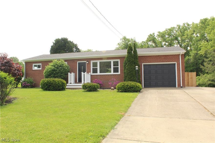 There's nothing left to do but move into this house!!  All new flooring and freshly paint throughout.  The kitchen has new cabinets, tile backsplash, granite countertops, and black stainless steel appliances.  The first floor bath has been updated with tile flooring, new vanity, sink, tile surround in the tub and light fixtures.  The bedrooms have laminate flooring.  Downstairs there is a family room, bedroom, full bath and laundry room.  The lower level bath has tile flooring, tile wall surround in the shower, new vanity and lighting.  There is a walk out entrance to the backyard from the basement.  The backyard is completely enclosed with a cedar privacy fence and a covered cement patio.  Exterior updates include new electrical panel with new service to the street, new roof, gutters,  front porch with composite decking/railings and doors.  The house is all LED lights, including color changing lights under the kitchen cabinets.  The hot water tank is new.  Highest gas bill in the wint