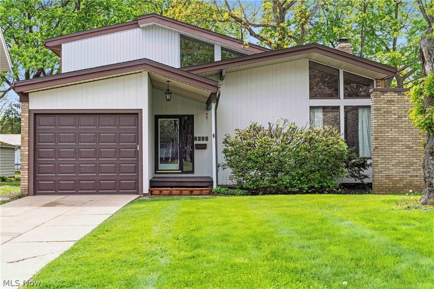 This is a rare chance to own an exceptional midcentury modern home designed and built by the architect Robert Goodman. Goodman trained at MIT, mastering the architectural principles and styles laid out by the great Frank Lloyd Wright, and his stylistic footprint is unmistakable in every room. From the FLW trademark central fireplace and open-concept floor plan to the towering 20-foot ceiling, this home is brimming with the values and attention to detail that show Goodman's indebtedness to the great master. With gigantic windows on both floors, a second floor overlooking the Great Room, a redwood front porch, and real mahogany paneling, this home is beautiful to look at and a pleasure to be in. Deep renovation and restoration work was undertaken 4 years ago by the current owners, adding a massive Trex deck in the backyard, stone countertops in the kitchen and bathrooms, and too many other upgrades to list. This isn't just a house, it's a living work of art that isn't just something you live in, it's something you experience. Schedule your showing today!