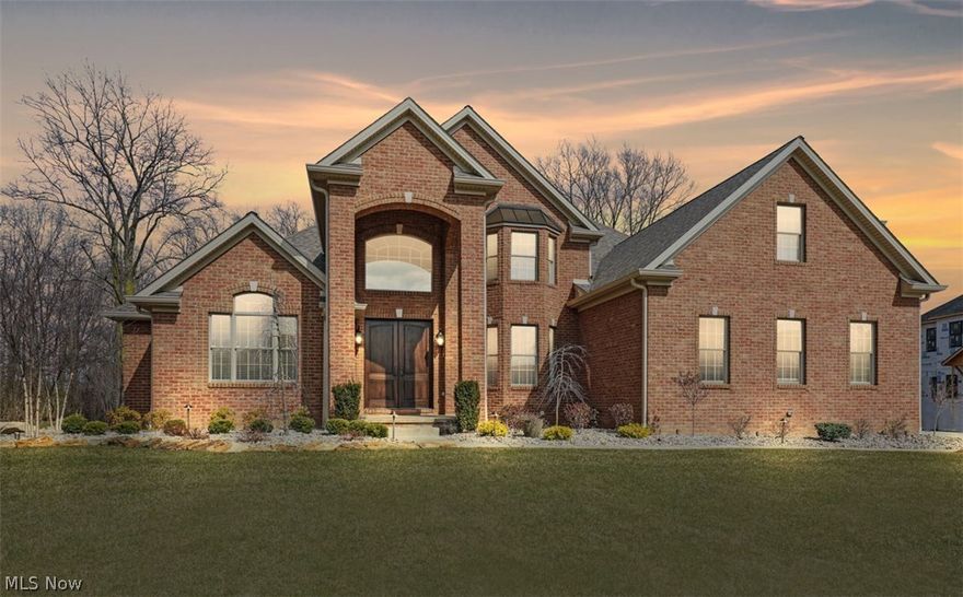 STUNNING 4 Bedroom Home in Exclusive GATED COMMUNITY at Desirable Kensington Golf Course Development with FIRST FLOOR MASTER and PRIVATE BACK YARD. This ALL BRICK Home has an Open floor Plan crafted with Superior Construction and Magnificent Quality with MIRAGE Solid hardwood floors, CAMBRIA Quartz Counter Tops throughout, GORGEOUS chandeliers, & HUGE Back patio w/outdoor lighting.  Home Features Include: DRAMATIC Open Foyer w/Stunning Chandeliers.  Great Room w/Floor to Ceiling Stone Fireplace plus Built in Lighted Bookshelves.  AMAZING Custom Chef’s Kitchen with Cherry Cabinets & under cabinet lighting, HUGE 6-Seat Island w/Quartz Counter Top, Trendy split-face stone Back Splash, & Top Of The Line Appliances, Formal Dining Room w/Unique 72 bottle Wine Storage Wall & Attached Ladder.  Beautiful First Floor Master Bedroom w/Tray Ceiling & Crown Molding.  Master Bath boasts Double-headed Travertine stone Shower with Rain Head, Double Vanity Sinks, His & Her closets, & Italian Tile-Wood