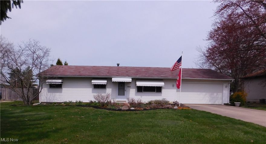 This 3-bedroom Ranch is not only affordable but move in ready! Everything all on one floor, no steps! It is larger than it looks with a spacious family room when you come in from the garage, great for your media/TV room nice carpet, a double closet for coats, boardgames, pantry items or storage and sliding doors leading to the covered patio and fenced half acre back yard. Come in through the front door into the hub of the home, the roomy living room fills with natural lighting from the picture window flowing into the eat-n kitchen. The kitchen has nice updates, counter space and appliances stay. The master bedroom has a full private bath with step in shower and crown molding. The main bath has been updated as well. Conveniently located the utility/laundry room is off the kitchen with more cabinets and washer & dryer stay if needed. New H20 tank installed Feb. '25. The two-car attached garage offers pull-down steps to the attic for more storage. Don't settle for a Condo or apartment when you can enjoy coffee on your covered patio or BBQ's with friends and family in the backyard, or if you love to garden there is plenty of space for that. Whether you're looking to downsize and desire everything in one floor or looking for an affordable first home purchase, this is it. This home is in a prime location offering easy access to parks, library, shopping, schools and medical assistance. Plus, I-480 and Ohio Turnpike just minutes away and 20 minutes to catch a flight at Hopkins Airport. This home is very clean and well maintained. Make it a must see!!