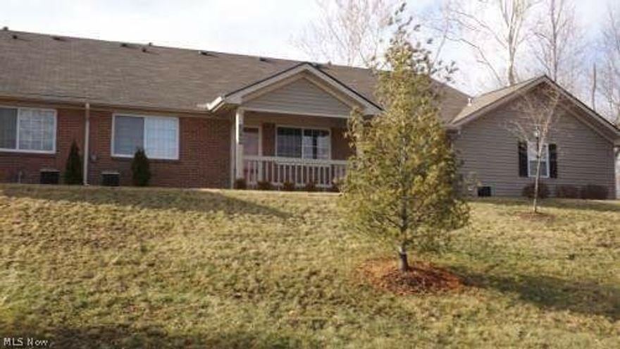 NEW carpet and paint!  2 Br, 2 Ba, All appliances included and washer/dryer. Nice front porch and garage attached to home. Faces Northpointe Drive.