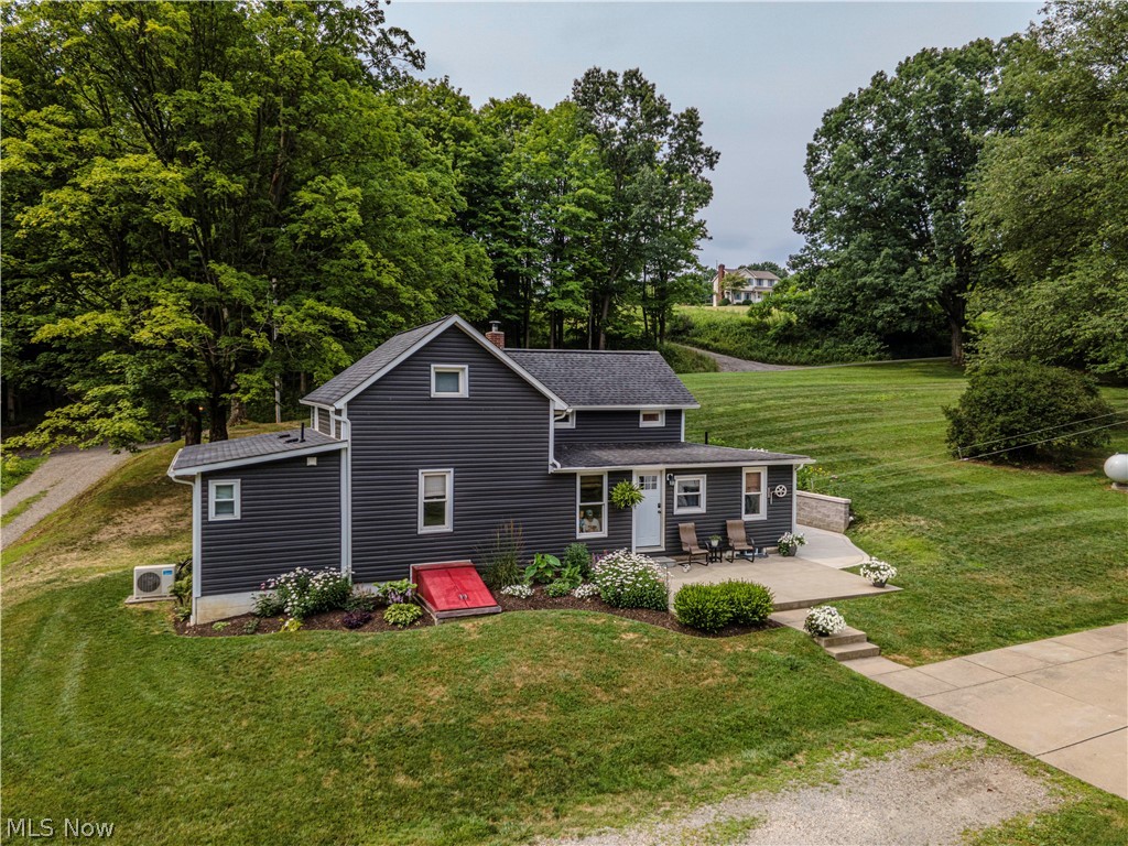 Nestled in a serene rural setting, this charming century home has the perfect blend of historic charm & modern convenience. Situated on a picturesque lot, the property boasts many updates while retaining timeless appeal. Step inside to discover a beautifully remodeled huge eat-in kitchen, a centerpiece of the home. Featuring ample space, this kitchen combines rustic charm with contemporary amenities. Whether preparing a family meal or hosting friends, the layout ensures functionality & style. A first-floor laundry room offers efficiency & enhances the home's practicality, making daily chores a breeze. Upstairs, two nice-sized bedrooms await, each offering comfort & tranquility. The layout provides flexibility for guests, children, or a home office, ensuring every need is met. The first floor Master Suite is a private retreat designed for relaxation, its spacious layout & serene ambiance offering a peaceful haven. Outside, indulge in the beauty of a well-appointed patio overlooking the large yard. Perfect for summer barbecues or quiet mornings, this outdoor space invites you to unwind & enjoy nature's beauty. A standout feature of this property is the amazing barn, offering endless possibilities for hobby farming or livestock enthusiasts with ample space & facilities to bring your vision to life. Located in a tranquil rural setting, yet within easy reach of amenities & major thoroughfares, this home offers the best of both worlds, peaceful country living with urban conveniences just a short drive away. Experience the charm & potential of this lovely century home firsthand. Whether you're seeking a peaceful retreat or a place to cultivate your passions, this property promises to exceed your expectations. Embrace the rural lifestyle you've always dreamed of, schedule a showing today & make this wonderful property your new home. Auditor indicates there are 2 beds and 1 full bath; but seller states there are 3 beds and 2 full bath.