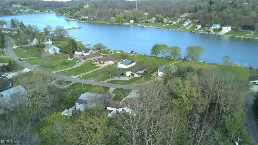 2 Lake Views • 2 Lots • 3 Gas Fireplaces • Come get it now ! • Enter through the 8 foot slider and discover how welcome you feel • Freshly remodeled ( Cty. Auditor states 2020 ) plus newer improvements recently • 3 Bedrooms • 2 Full baths • Fabulous Kitchen! with Full Overlay Shaker Cabinets • Butcher Block Island & Countertops • Under cabinet adjustable lighting • Kitchen opens up into a wonderful backyard & small fenced in area for your special furry friends • Entire main level has Eucalyptus Wood flooring ( except bathroom ) • 2nd Lot, Corner Wooded Lot has Frontage on Latonka, Yes you could cause a driveway from there also • Let your Imagination go wild - add on, seperate large garage, sepearte druveway, store your toys, Etc- Etc • Lower walk out Patio level features brick pavers • Beamed ceilings in Kitchen and Living room areas • 508 Sq Ft of deck upper level • Newer 8 ft slider • HUGE 26 X 12 Family room downstairs • Garage is 20 X 22 and features pebble tech flooring • Garage door has Cool non see thru glass • Shed is 8 X 12 • Driveway has large extra area for visitors or storing toys • Property includes Lot's 985 & 986 • You will LOVE the 500+ acre Lake with no HP or speed limit for boating, swimming, fishing, 3 Beaches, Clubhouse, tennis & pickleball courts, baseball field and of course a Golf Course • New 100 Amp Service from the weather head down to the breaker box in 2021 + New meter socket & service wire in 2024 • Water Softener owned • Radon mitigation system installed by previous owner • Seller will retain Mineral Rights •