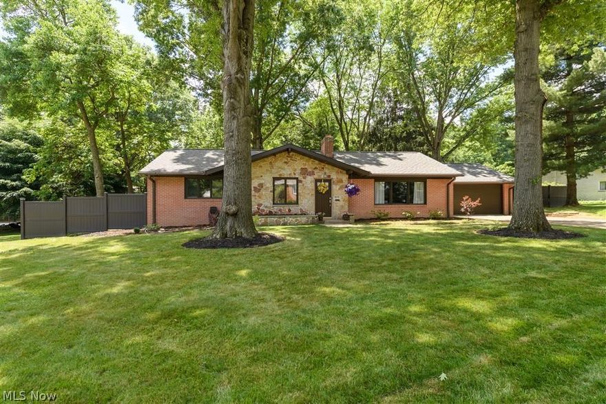 This beautifully updated and presented brick and stone Ranch is ready to move into! Perfectly posed on a corner lot in a quiet, mature neighborhood this home comes with many newer additions. Updates Include but not limited to: Stunning kitchen with granite-stainless steel appliances- custom backslash- under mounted sink- wood floor- custom cabinetry, stylish paintwork and carpet in living and dining area, custom painted three nice sized bedrooms w/wood floors and 1.5 newer bathrooms, outside doors, gutters and helmet guard, light fixtures and more. Roof approximately 9 years old.  A four season sunroom overlooks the private, vinyl fenced treed backyard with patio. Picture perfect and ready to please the new owners! Extremely close to all amenities.