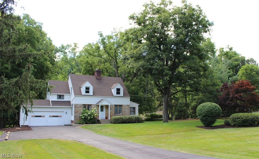 Nothing to do but move in to this completely updated Brecksville Cape!  Situated on a quiet street and a beautiful lot, this home is located very close to everything that people love about Brecksville.  The Eat-in Kitchen is fully updated with Kraftmaid Cabinets, Granite Counters and stainless appliances.  The living room features a wood burning fireplace and crown molding.  Off the living room is a bonus living space, which leads to a large deck, overlooking a truly amazing back yard with views of Chippewa Creek.  The entire first floor has hardwood floors and recessed lighting throughout.  The second level has three well-appointed bedrooms and an updated full bath.  All new paint and carpet upstairs (2016).  The basement, which is nicely finished, includes a large living area great for a rec-room, office or play area.  Also, in the basement is a nice laundry space with plenty of storage, and a second wood burning fireplace.   On top of all of the updates that await the next owner of
