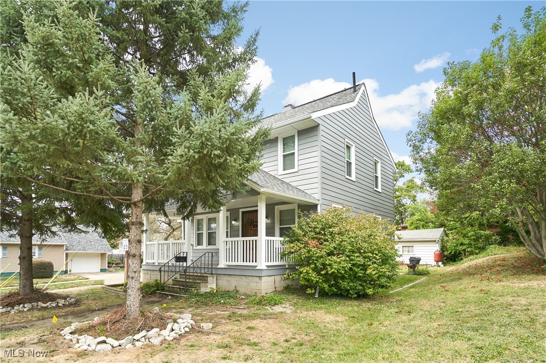 Welcome to this charming 3-bedroom, 3-full-bath home in Akron's North Hill neighborhood. Inside you will find a spacious living room and a formal dining room filled with natural light from a stunning wall of windows. The kitchen offers a convenient breakfast bar & plenty of cabinet space. Original woodwork runs throughout, adding timeless character to the home. Upstairs you will find 3 generously sized bedrooms, and an updated full bathroom with built-ins. Also featuring an unfinished basement, perfect for storage, detached garage and back patio overlooking the private back yard. Recent updates include a newer roof, siding, windows, driveway and a welcoming front porch—giving peace of mind and curb appeal!