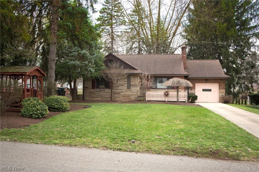 Welcome to your new Plain Local School District home at 3420 Enfield Ave. NW.  This gorgeous brick and stone home is very well maintained. The outdoor property has been custom landscaped with a stunning gazebo in the front yard island. LOCATION! LOCATION! LOCATION! This home is directly across from the sought after Avondale neighborhood. Home includes new carpet in bedrooms (hardwood under carpet), new refrigerator, new spouting with leaf guards (2011), hot water tank 2 years old. Gorgeous built-in china cabinets in dining room. Very retro features. Updated main bath. New deck and rear door access with an additional patio for fun outdoor entertaining! Call me to show you your new home today!