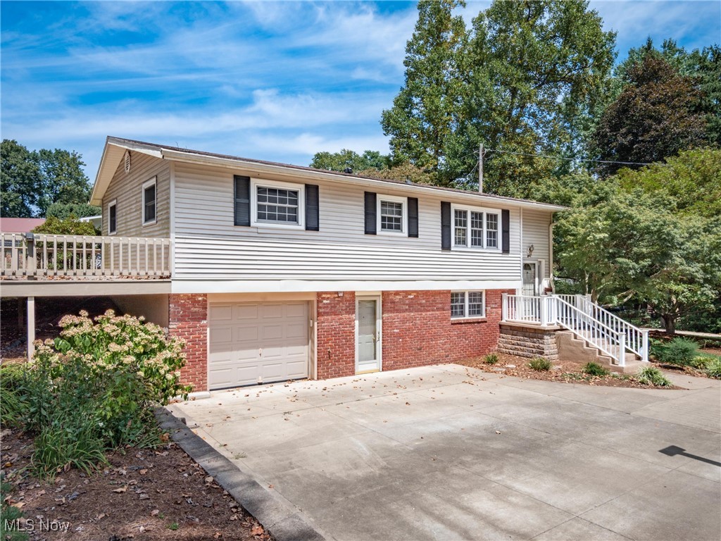 Discover the delight of serenity in this charming 4-bedroom, 1.5-bathroom house with a lot that emulates a parklike setting. Freshly updated, this home features an open floor plan that invites you to breathe as freely indoors as you do under the canopy of mature trees that adorn the property. The newly finished lower level promises an added layer of spaciousness, perfect for entertainment or a peaceful retreat. Step into the kitchen, and you might feel like a chef, thanks to plentiful cabinets and ample countertop space, which make meal prep a breeze. Outdoor entertaining is a dream on the large deck overlooking a verdant landscape, making your home the envy of every nature lover. A concrete driveway plus extra parking ensures there's always room for guests. There are many updates throughout.