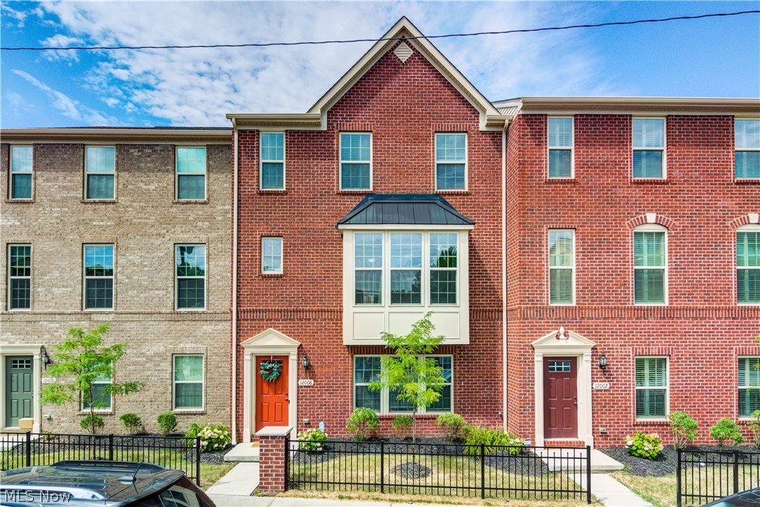 This is the one you have been waiting for! Perfectly situated in Rockport Square this luxury townhome is an absolute stunner. There is nothing left to do but move in and enjoy over 2300 square feet of expansive living space. This 3 bedroom, 2.5 bath, brick exterior, attached 2 car garage with exterior pad entry and dual entry into the home from garage, 9' ceilings on the 2nd floor, open concept floor plan with an abundance of windows offering natural light, gourmet kitchen with recessed lighting, and upgraded finishes, built in hutch and gourmet island with breakfast bar plus stainless appliances included! Dining area opens into kitchen and provides perfect space for entertaining; rear deck off dining room is a fabulous spot to enjoy a the fresh air. Enjoy relaxing in your living room with oversized bay window and nook area. Large owners bedroom layout features an oversized walk-in closet and spacious full bath with dual sinks, soaking tub and separate glass shower. With 2 additional b