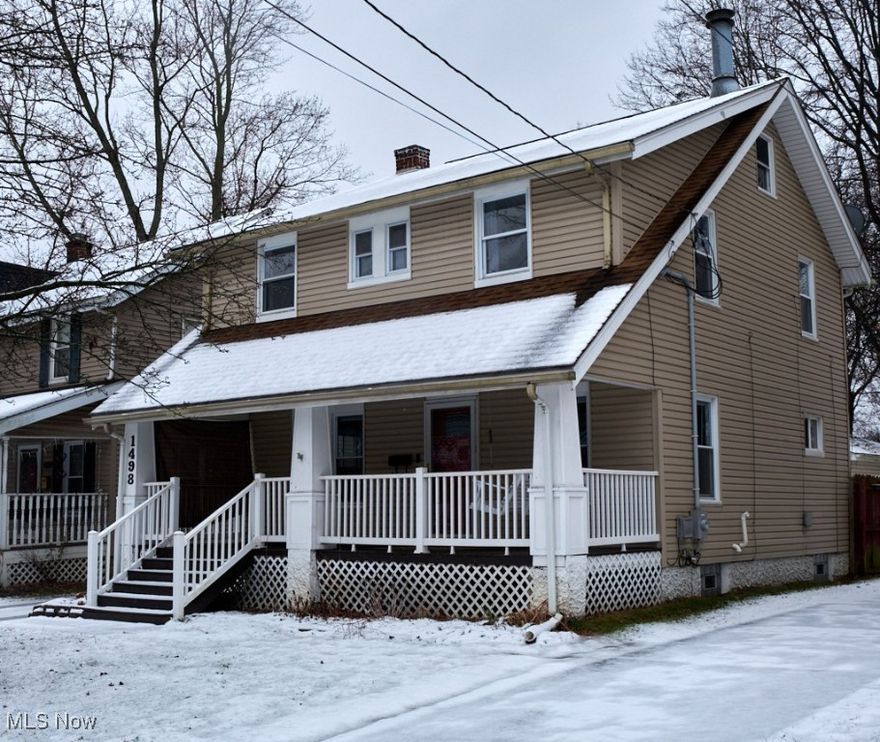 Come see this beautifully maintained, move in ready Colonial home in the heart of Cuyahoga Falls. See an inviting front porch with charming wood plank flooring before entering the home. Inside the living and dining rooms shine with beautifully maintained original hardwood floors and abundant natural light. The kitchen is both stylish and functional, featuring elegant cabinetry, tile flooring, and stainless steel appliances. All the updated with a fresh coat of paint to give a warm and modern feel. Upstairs, you'll find three well-sized bedrooms and a spacious full bathroom with a tub/shower, plus built-in hallway cabinetry for convenient linen storage. Plus additional storage in the walk-up attic with potential for an additional finished space! The lower level provides additional recreational space, along with ample storage, a large laundry area, and a half bath. Outside, enjoy a generous deck that leads an oversized detached two-car garage hooked up with electric. Don't miss out on this wonderful find, schedule a private showing today!
