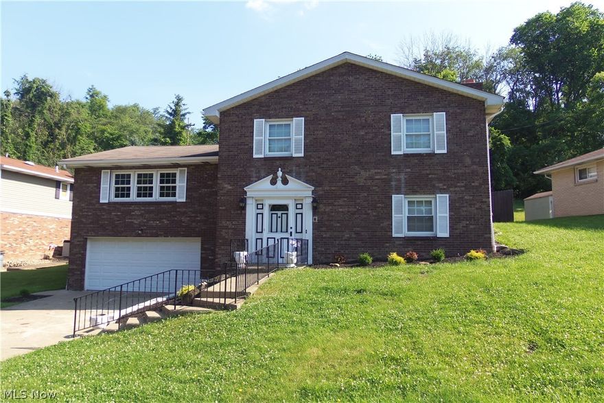 BIG AND BEAUTIFUL!  4 BR, 3 bath brick located on Weirton Heights within minutes to Rt 22 and all conveniences.  Generously sized rooms offering an eat-in kitchen, formal dining room and spacious family room with brick fireplace and bath.  Master BR with bath, 2 car garage w/ 2nd kitchen, central air and covered deck overlooking a fenced yard are just some of the amenities this home with just over 2600 sq ft has to offer!