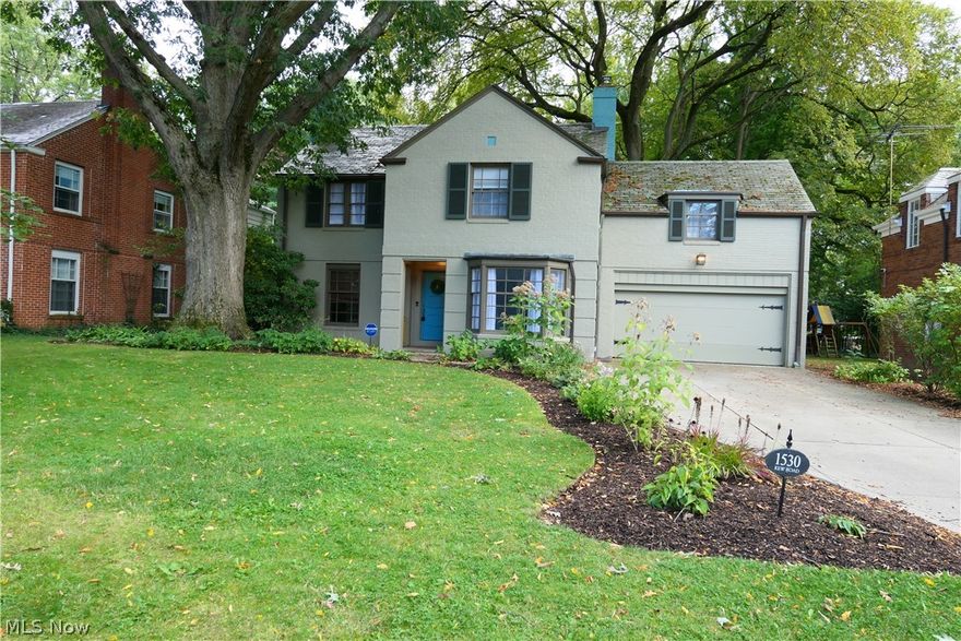 Tastefully updated Cleveland Heights Home, full of character and charm.  This private home sits on an oversized lot with mature tress and landscaping in the popular Forest Hills neighborhood.  From the front door walk into the oversized living room with a cozy fireplace and French doors to the sunroom.  Opposite the living room you find the dining room accented by a traditional chair rail and bay window.  Stainless appliances highlight the kitchen with an eating nook over looking the scenic backyard.  A quaint powder room rounds out the first floor.  Enjoy 4 bedrooms and 2 full baths, all on second.  The Master en-suite boasts marble tops and chic designer touches.  The additional bath can be accessed by the other bedrooms or included as a guest en-suite with the 4th bedroom.  Rounding out the interior space, the basement space is perfect for a family room, man-cave, play room or bonus space.  Cleveland Heights is home to International Baccalaureate schools, Cain park, Heights Recreati