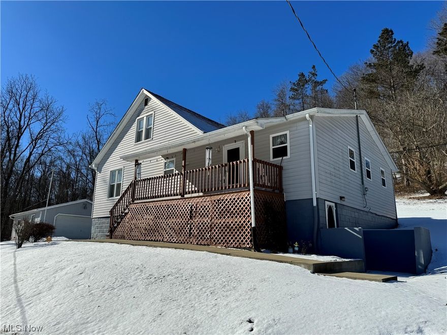 Look no further for your own peace and quiet right outside of St. Clairsville! This house comes with so many bonuses including an extremely large eat-in kitchen, two bedrooms on the first floor, main floor laundry room right off the kitchen, updated vinyl windows, complete basement waterproofing with sump pump and industrial dehumidifier, newer sidewalks, NEW Septic System installed in 2023, and a third bedroom on the second floor which could even be split into a fourth one! This has been the seller's home for almost 44 years and has been exceptionally cared for. There is tons of natural light throughout the whole house and the large double car garage is right off the side porch. New survey completed in June 2021. Property shares driveway with neighbor and they split the maintenance costs. Mineral rights, including oil and gas rights will not convey.