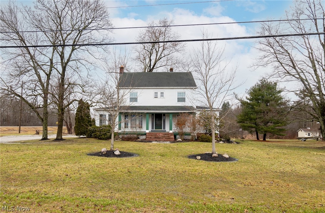 Welcome to 7032 Darrow Rd! This character-filled 3 bed, 2.5 bath colonial sits on a 2 acre lot and is located near the desirable heart of Hudson! Enter and be welcomed by a large foyer that grants access to the living room and sunroom, each with their own fireplace. Natural light completely fills the main level. Back stairway and half bath both provide entry to a spacious back deck. Upper level includes three bedrooms and full bath. Room on the third level as well as the basement can be used for fourth and fifth bedrooms. Detached garage includes loads of storage space and a workshop area. You do not want to miss out on this amazing investment opportunity! Schedule your private viewing today!
