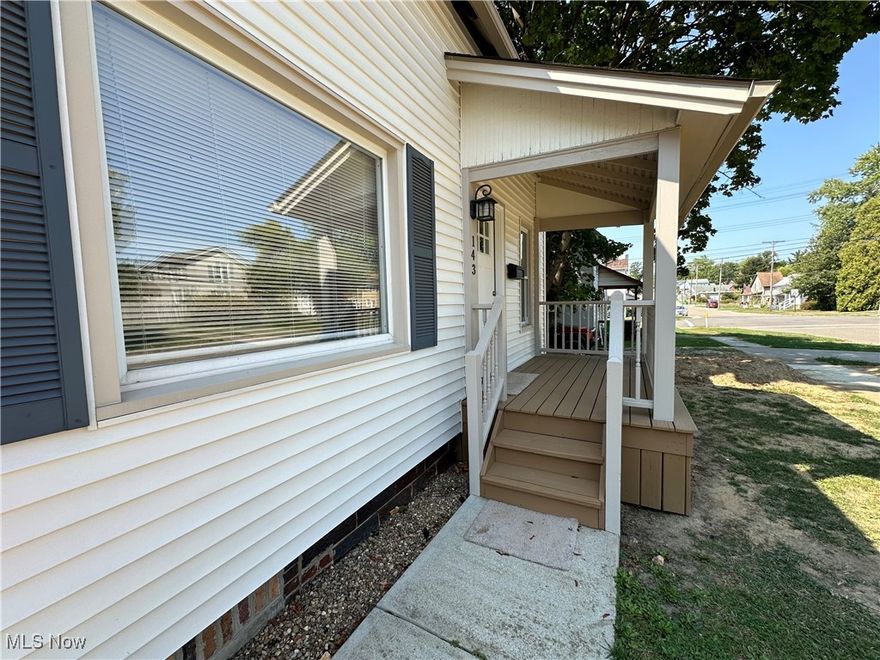 This beautifully updated bungalow features new flooring, fresh paint, and stylish shiplap accents throughout. Step into the spacious foyer, which flows into the bright living room with a large picture window. The eat-in kitchen has been fully updated and is perfect for casual dining. The home offers a first-floor bedroom and a large upstairs bedroom with an additional bonus room. Relax on the charming covered front porch, ideal for enjoying quiet mornings or evenings. The attached one-car garage connects to the kitchen through a convenient mudroom. The 13-course basement offers plenty of space for additional living or storage. The large backyard, which extends to the alley, provides off-street parking. Updates: New LVT Flooring 2024 in Kitchen & Foyer. 2015 Roof, HVAC, Hot Water Tank, Plumbing, Bathroom, Ceramic tile in Mudroom and Bath, Trim and doors.