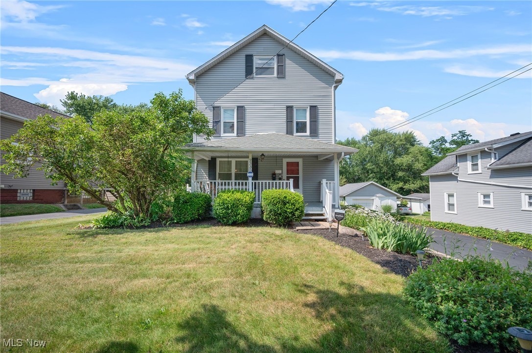 Well-maintained & spacious Colonial located on a tree-lined street in Akron’s Ellet neighborhood, set on over .37 of an acre and a rare double lot. This charming home offers 4 bedrooms, 2.5 baths & over 2,527 sq ft of living space including a finished 3rd floor & finished basement. The oversized 2.5 car garage is a handyman's dream, w/ 12-foot ceilings, workbenches, built-in cupboards, 13 electrical outlets & a 220v box, plus a loft ideal for a playhouse or hobby space. Enjoy the welcoming front porch & covered back porch, perfect for relaxing or entertaining. Inside, details like crown molding & wainscoting complement the functional layout. The eat-in kitchen includes all stainless steel appliances, double wall ovens, center island w/ cooktop & a dinette area that opens to the back porch. The main level also features a living room & formal dining room. Upstairs, the primary suite offers access to a private balcony, en-suite bath & separate dressing room w/ vanity & walk-in closet. Another 2nd-floor bedroom includes a bonus sitting room that could serve as a 5th bedroom or den. Two additional bedrooms & a full bath are located on the finished 3rd floor. The spacious yard includes a shed w/ a concrete floor, electricity & LED lighting, adding even more functional space to this unique property. Recent updates include: Replaced windows (2017/2022), hot water tank (2024), upgraded A/C (2023), refrigerator (2023), dishwasher (2022), resealed driveway & installed new landscaping (2025), replaced garage door opener (2019), installed LED lighting in garage (2022) & shed (2025), repaired & painted porch (2025), replaced roof & siding on house and shed in w/ 30-year architectural shingles (2012), and much more. INCLUDED are ALL kitchen appliances, washer/dryer, SimpliSafe security system, window treatments, and a 1-year home warranty. Conveniently located just minutes from Tallmadge amenities and near I-76, shopping, restaurants, parks, and other local attractions.
