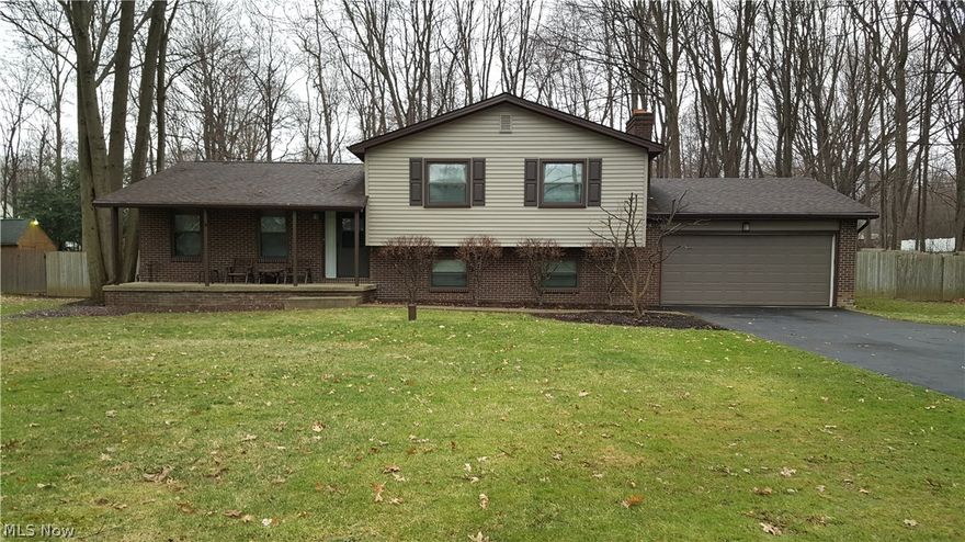 It is Apparent!! These homeowners have done their home-work throughout the years, and have meticulously maintained this wonderful family home. This spacious 4 level split features kitchen w/newer appliances, countertops, flooring, breakfast bar and open to dining room (slider to deck) and living room area. Lower level w/fantastic family room w/woodburning fireplace, 2 1/2 bath and walk-in-laundry room-clean partial basement. 3 sizeable bedrooms, Master w/full bath and 2 double wall closets. Updates include new roof, windows, and siding, interior all freshly painted-desirable neutral decor, newer carpet, and flooring. Large fenced in back yard deck and shed, 2 car garage and the always requested "covered front porch!" This larger home is great for entertaining!No septic, just well. It is spotless, no grime here! A positive----move in ready---!