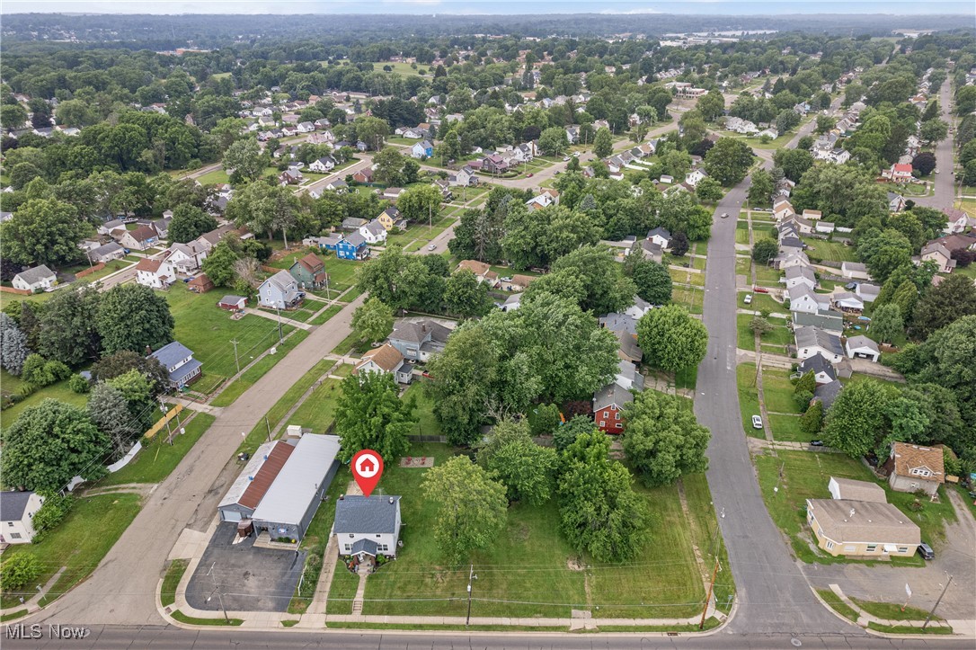 Welcome to 3609 Mahoning Ave NE in Canton – a beautifully updated home where all the hard work has already been done for you! This 3-bedroom, 1-bath charmer sits on nearly a half-acre lot (.45 acres) and has been thoughtfully updated inside and out. Step into the spacious living room featuring a cozy fireplace, flowing right into the dining room filled with natural light from its large windows. The gorgeous bathroom feels like a retreat with dual sinks, a walk-in shower, and a classic claw-foot soaking tub – perfect for unwinding after a long day. Updates? This home has them all: Newer windows, flooring, and paint; Fully updated kitchen and bathroom; Newer HVAC for peace of mind; Basement waterproofed & updated electrical; New sewer line; Roof scheduled to be replaced soon. With nothing left to do but move in, you’ll love the combination of modern updates and timeless charm. The spacious lot gives you plenty of room to enjoy the outdoors, while the home itself offers comfort, style, and function. Don’t miss this one – homes like this don’t come along often!