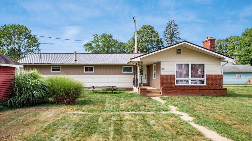 More bedrooms, more space, more possibilities! Curb appeal meets comfort at this inviting ranch on Cherry Street, where a manicured lawn and covered front porch make you feel instantly at home. Inside, the kitchen opens to a sunny breakfast nook and a flexible dining and living area—perfect for weeknight meals, lively dinner parties, or slow Saturday mornings. Just beyond, the family room sets a warm, welcoming tone with its full brick fireplace wall, complete with custom wood insets and a rustic mantle ready for photos, books, or travel treasures. With five generously sized bedrooms and two full baths, including a convenient first-floor primary suite, there’s space for everyone to relax. The full walk-out basement extends the living area even further, offering endless options for a rec room, home gym, office, or guest retreat. Out back, a private porch is ideal for morning coffee or summer evenings, while the oversized 1,296 sq ft garage is a dream find—fitting 3+ cars with ease and featuring an attached bonus room perfect for hobbies, a workshop, or game nights. All this sits in a friendly neighborhood just steps from River View community park, playgrounds, and ball fields, with dining, shops, and River View schools nearby. Plus, quick access to State Route 36 keeps everyday errands simple while preserving that small-town charm. Get ready to enjoy this home that welcomes you today and grows with you for tomorrow.