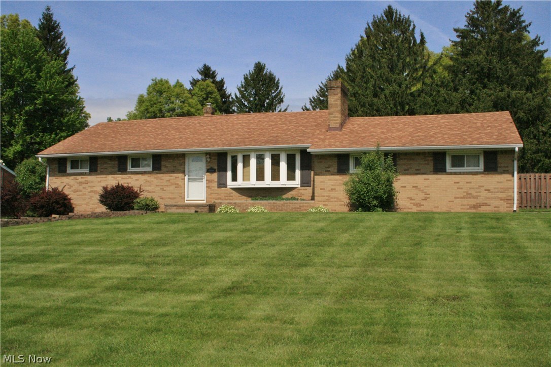 Welcome to your new home! This all brick ranch is in pristine condition, with all appliances staying including washer & dryer, all that's left is moving in your furniture. Fully fenced in private backyard. Finished space in the basement adds almost 700 square feet of living space, with a dry bar and plenty of storage. Kitchen appliances new in 2015, and a new garbage disposal 2017. Hardwood underneath carpet on first floor. Radon mitigation system, newer hot water tank, and a one year home warranty offered with this fantastic home. Mineral rights transfer with home. Don't miss out on this gem!