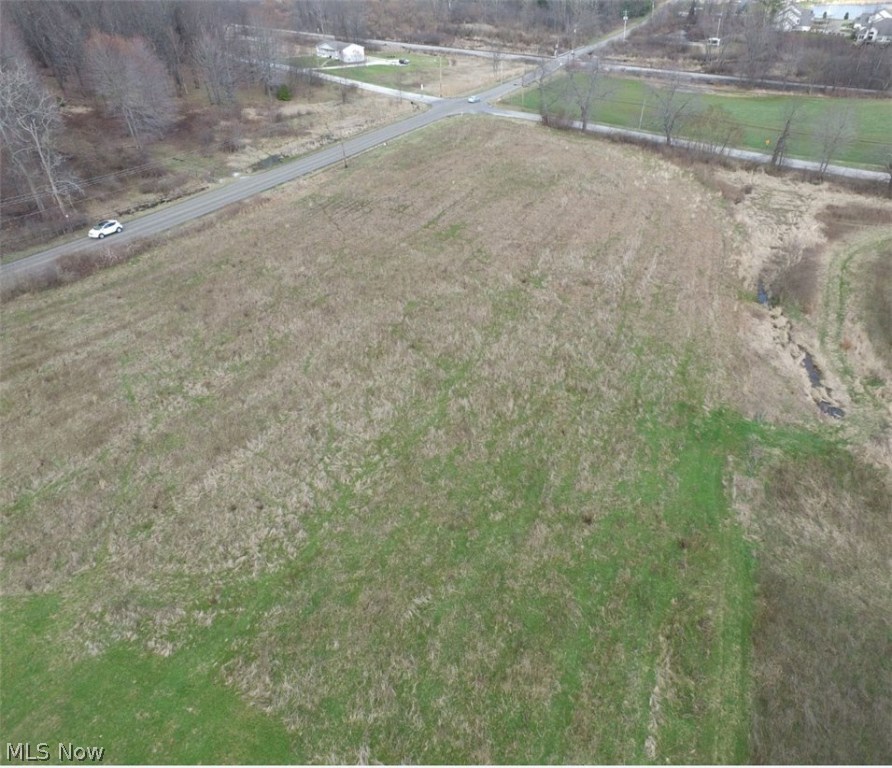 Perfect location to build your dream home on this 5.05 acre corner lot in Brimfield! Located on the corner of Sunnybrook Rd and Howe Rd. you are nestled in the country yet close to shopping, dining, highways, KSU and Tallmadge! Located across the street from Spring Water Park! Gorgeous setting. Sewer is available at the street. Bring your own builder! Seller will consider owner financing!