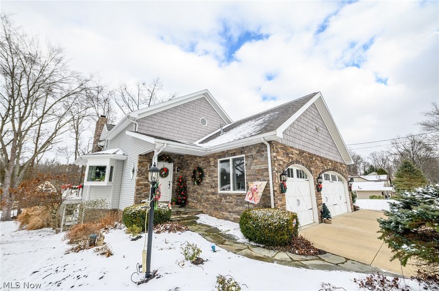 Lake Auction Services Auction (Not a Live In-Person Auction). Published List Price is the "Suggested Starting Bid" and not a "Reserve Price". No Extra Buyer's Fees. Submit Offers Now because the Seller can Sell before the Auction Date. Lake front 4 bedroom, 4.5 bath home in Willowdale!  First floor living with lake views that be admired from 3 sides of the home! Spacious kitchen with stainless steel appliances, solid surface countertops, vaulted ceilings, wine rack, spice drawer, 2 ovens, 8-foot deep pantry and center island with breakfast bar and pull out drawers. Open great room and dining room features floor-to-ceiling stone fireplace as well as deck access. A sunroom at the back spans the width of the home and offers amazing views. Sliding doors to the first floor master suite with a fireplace and a private master bath with dual sinks, a Jacuzzi tub, shower and a 12x10 walk-in closet. First floor laundry room and half bath. Upstairs, there's a huge loft overlooking the kitchen. There are 2 bedrooms up. Suite with a private bath and bedroom with direct access to a full bath with dual sinks. The finished, walkout lower level offers a family room with a fireplace and wet bar, an office, a craft/game room, a 4th bedroom, full bath and a stunning back porch. Fantastic side deck with steps down to the dock! Heated, 3-car attached garage! Enjoy access to Willowdale Country Club with a restaurant, beach, playground and patio. Lake front living at it's finest! This one won't last!