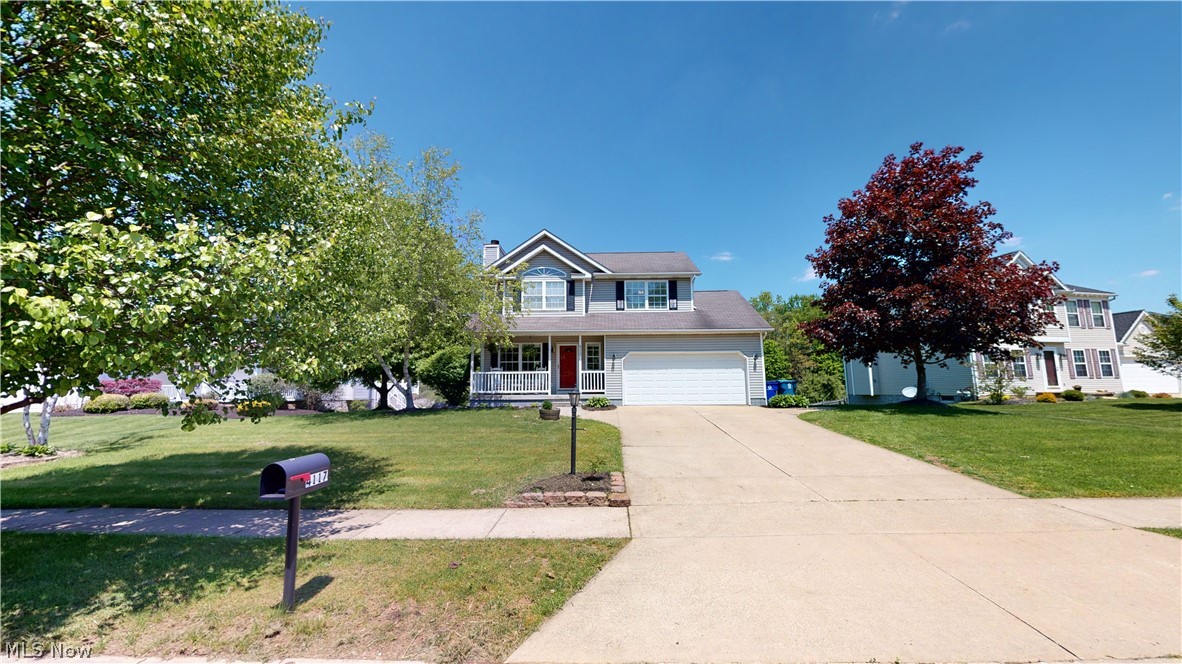 Wonderful 3-bedroom, 2-1/2 bath updated Colonial in Timber Run. Large, bright living room with gas fireplace with new fieldstone hearth, open to eating area and kitchen with all appliances and island with butcher block top and concrete countertops and farmhouse porcelain sink, that leads to 2nd story deck, overlooking the "Nature Preserve" behind your backyard!!! Living room and kitchen have floating, distressed/hand scraped laminate flooring, 1st floor laundry/mud room and half bath have ceramic floor. Upstairs is Master bedroom with cathedral ceiling, walk-in closet and master bath with double sinks and cathedral ceiling. Two more large bedrooms, one with another cathedral ceiling, and one with a wall of distressed barn wood, and full bath with yet another cathedral ceiling complete the upstairs. Lower level is unfinished but is a walk-out to patio and has a movie screen on wall from previous theater room, lots of possibilities here! There's also attached 2-car extra deep garag