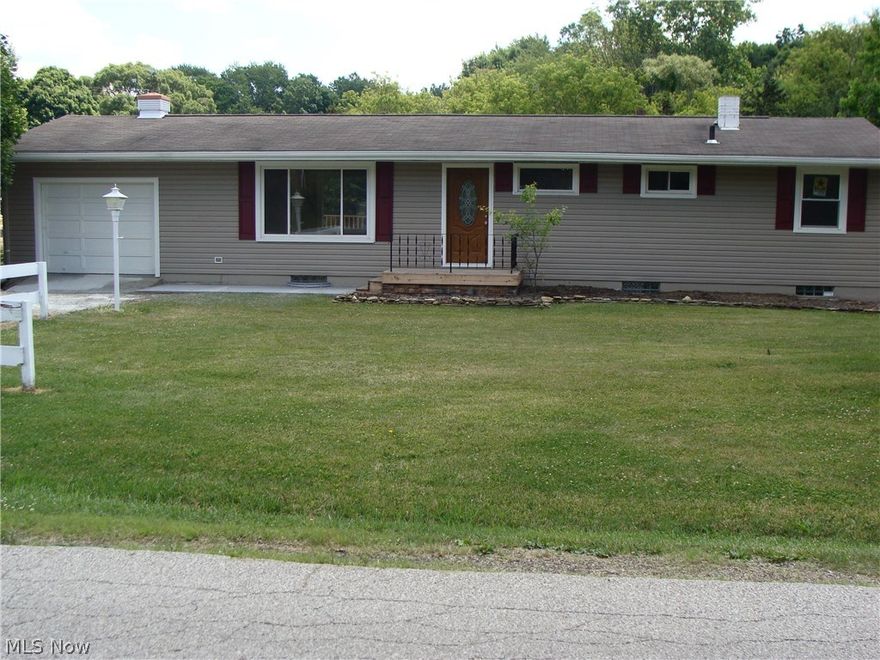 You have to come see this wonderful 3 bedroom 2 bath home. Don't be fooled by the Kent mailing address the home is in Stow with Stow- Munroe Falls schools. This home has so many new things, here are some, siding, Pella thermapane  windows, kitchen cabinets, glass tile back splash, countertops in kitchen and bathrooms, carpeting in bedrooms and living room ( hardwood floors under carpet), title flooring, Pella exterior doors, front porch, back deck, tile work on walls in both bathrooms,  bathroom fixtures, stainless steel appliances, light fixtures in every room including recessed lighting in the living room as well as accent lighting near ceiling in kitchen and living room, A/C unit, washer and dryer, and a new hot water tank. There are cathedral ceilings in the kitchen, living room and two upper bedrooms. In the walk out basement is the family room with laminate flooring, one bedroom and one bath, and a bonus room that could be used for playroom, craft room or whatever you want, that