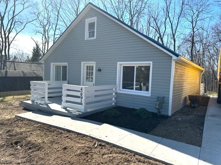 Charming and recently renovated home all new drywall, electric, plumbing, 2 1/2 baths, new kitchen and appliances, new flooring throughout, new gas furnace and central air, new siding and roof.  This open flr. plan is gorgeous, everything in the house has been renovated.  2 first flr. bedrooms, second flr. bedroom has new twin beds that can connect for king size, second flr. bedroom accessed by the spiral staircase offer new full bath w/tile walk in shower.   One of the first flr. bedrooms have a surprise room w/half bath and great area for adults or children to hang out with surround sound.  New concrete driveway and sidewalk.  Nothing to do but move in.