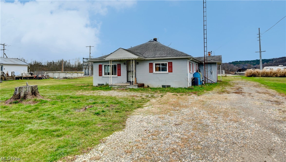 Ranch home with tons of potential. 2 Bedrooms, 1 Bath with attached garage on large lot. Will need new septic.