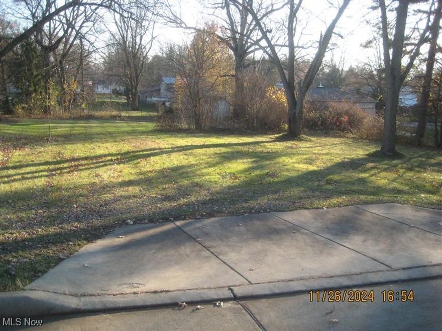 Vacant lot with 2 parcels.  Some mature trees on the lot.  Mogadore Local Schools.  This property is eligible under Freddie Mac First Look Initiative through 5/30/2025. The property is sold in AS-IS Condition.  Buyer to verify all information.  Buyer or Buyer's Agent responsible to check with Building, Zoning, EPA, DEA, Tax Department or any other requirement for intended use.  Buyer to pay for all inspections.  Earnest money to be a cashier's check.  Subject to clear title.