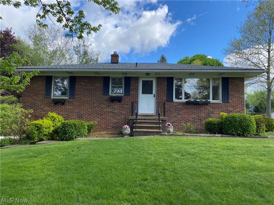 Don't miss this one!  Well-kept Brick Ranch home in a convenient Green location.  Beautiful Living room with hardwood flooring/trim.  Recently updated Kitchen with newer cabinets, lighting, countertops, flooring  &  appliances.   The walkout lower level includes a Rec room/bath & laundry area , storage area, &  an attached garage.  Relax outside on the appx. 1/2 acre lot, enjoying the large pool & deck...…....or sitting under the pergola on the paver stone patio.
Storage shed for garden tools, lawn equipment etc. too!  Take a look at this home in this beautiful neighborhood...…....you'll be glad you did!