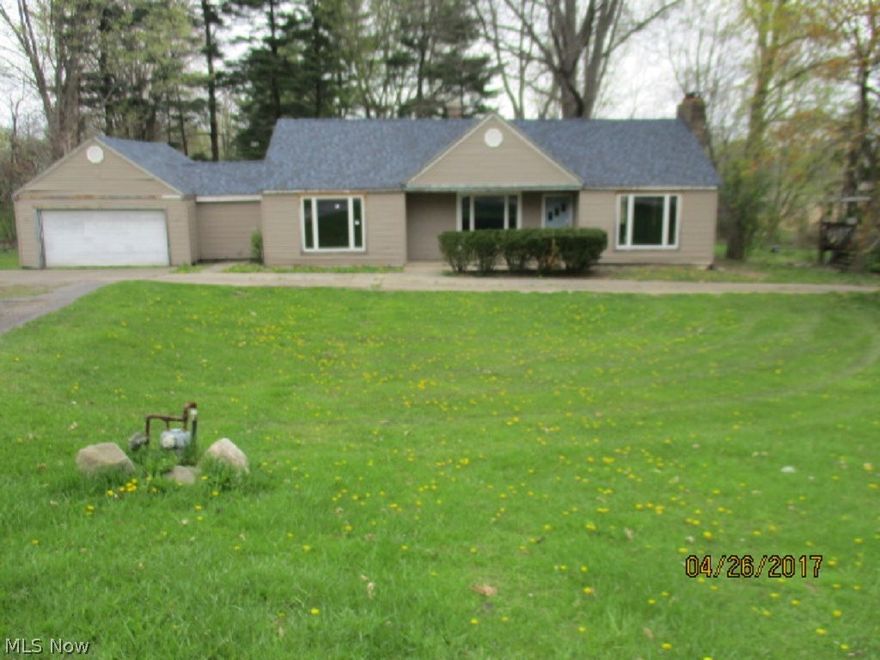 Country living with city convenience. Over 1 acre of partially wooded land! Expanded ranch style home has living room with fireplace and large picture window. Family/dining room. Basement. Attached 2 car garage. Wood deck in rear yard. Deep backyard with room to roam. Needs a lot of TLC and upgrades. Huge potential! Don't miss this one!