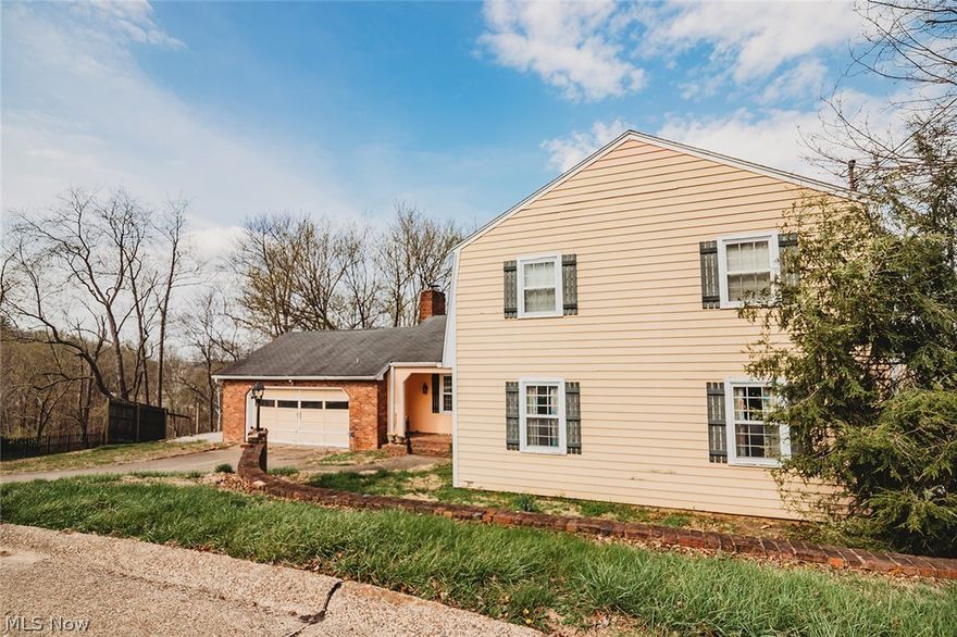 Beautifully maintained two-story traditional offering approximately 2,800 square feet of finished living space above grade, plus an additional 800 square feet in a walk-out basement.

The main level features an inviting eat-in kitchen, formal dining room, expansive living room, den, half bath, and convenient first-floor laundry. Predominantly hardwood flooring adds warmth and character throughout the primary living areas.

Upstairs, the spacious primary suite includes a private bath and walk-in closet, accompanied by three additional bedrooms and a full hall bath — providing generous space for family or guests.

The walk-out basement offers flexible finished space ideal for recreation, home office, or workout area, with additional unfinished space for storage.

Step outside to massive rear decks overlooking the backyard — perfect for entertaining or relaxing. An attached two-car garage completes this well-designed home that blends comfort, space, and functionality in a desirable Vienna location.