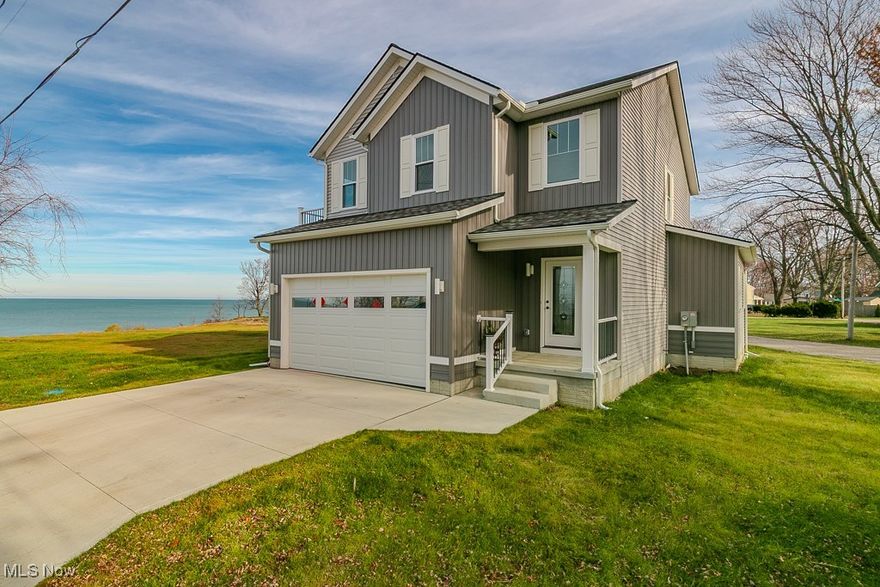 Lake Living at Its Finest!
Welcome to this brand-new, custom-built home where quality craftsmanship meets stunning Lake Erie views. This 3-bedroom, 2.5-bath residence offers thoughtful design and luxurious finishes throughout.
Step inside to find custom hardwood interior doors, LifeProof flooring, and recessed lighting that enhance the home’s warm, modern aesthetic. The Therma-Tru entry doors provide both beauty and energy efficiency, while hands-free faucets in the laundry and half bath add a touch of everyday convenience. 9-foot ceilings on both the first floor and in the basement create a spacious, open feel throughout. 
The gorgeous kitchen is a true centerpiece, featuring Forevermark cabinetry, premium appliances, and plenty of space for entertaining. Open Living Room with electric fireplace with built-in storage. Upstairs, you’ll find three spacious bedrooms including a master bedroom with attached full bath, trey ceiling, double closets and the other two bedrooms share a Jack and Jill bath. There is also a convenient second-floor laundry, designed to make daily living effortless.
Step outside onto the sprawling composite side balcony, where you can relax and take in spectacular Lake Erie views—the perfect spot for morning coffee or evening sunsets.
Enjoy the best of lake living in this thoughtfully crafted home that combines modern luxury, comfort, and breathtaking scenery!